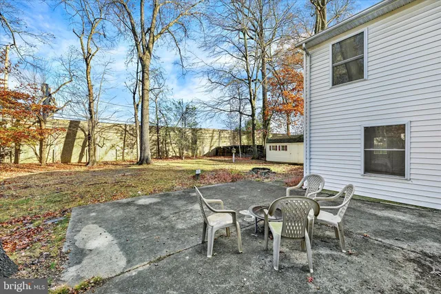 a view of a patio with table and chairs and couches