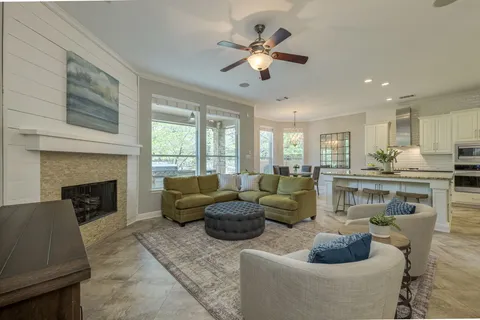 a bathroom with a granite countertop sink a toilet and a mirror