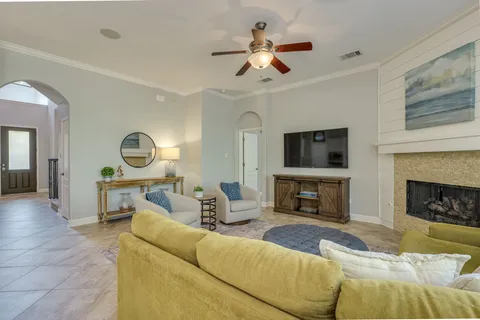a bedroom with a bed and large window