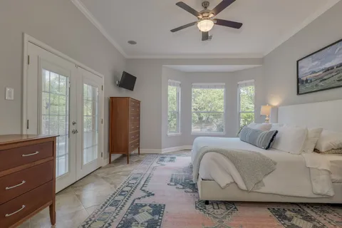 a bedroom with a bed and window