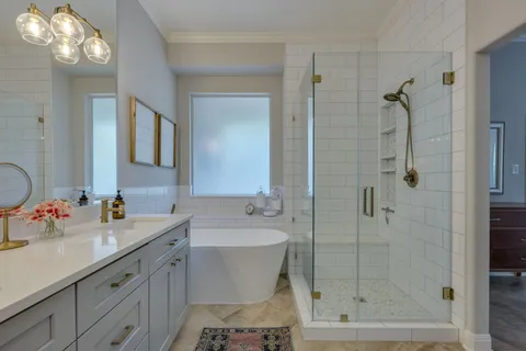 a bathroom with a sink double vanity and a mirror