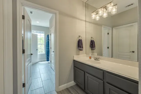 a kitchen with a stove and a large window