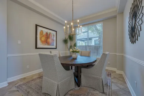 a large kitchen with kitchen island granite countertop a sink and a stove