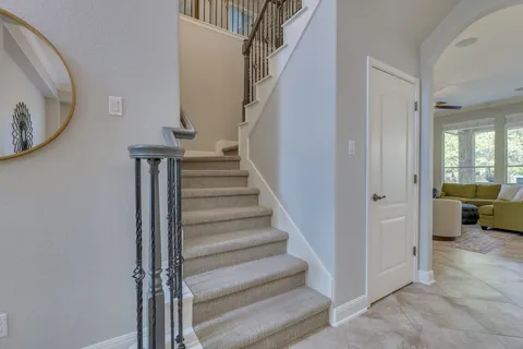 a kitchen with stainless steel appliances granite countertop a sink a stove and cabinets