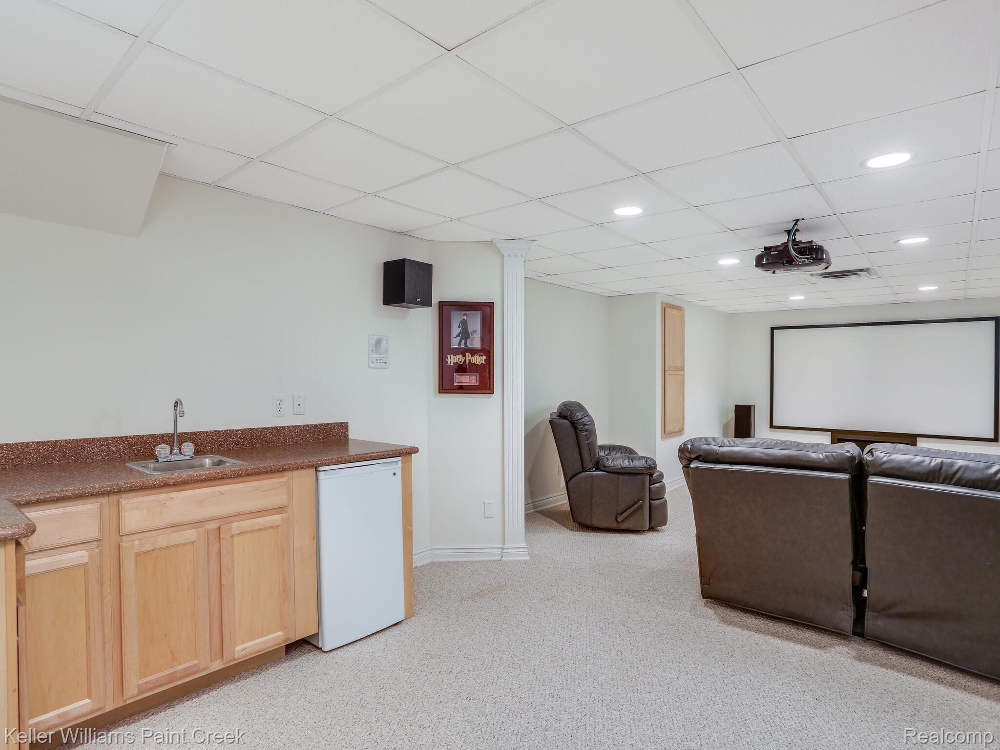5655 Kirkridge Trail Rochester, MI 48306 - Photo 28 of 34 Equipped with a kitchenette for uninterrupted movie treats.