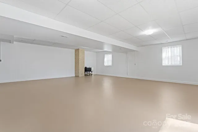a view of empty room with windows