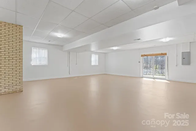 a kitchen with white cabinets and white stainless steel appliances