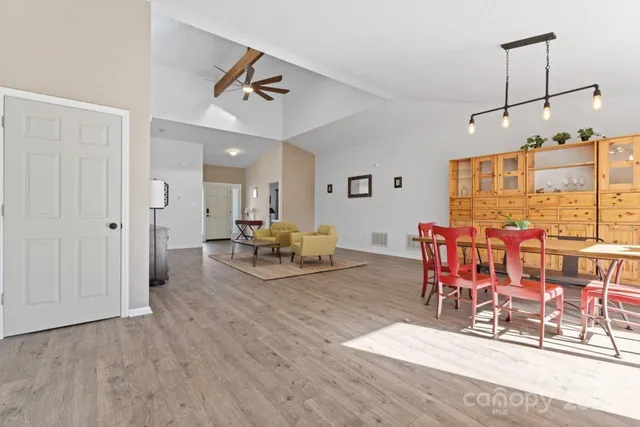 a view of a dining room with furniture window and wooden floor