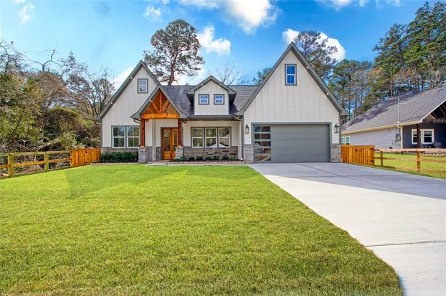 a house view with swimming pool and garden space