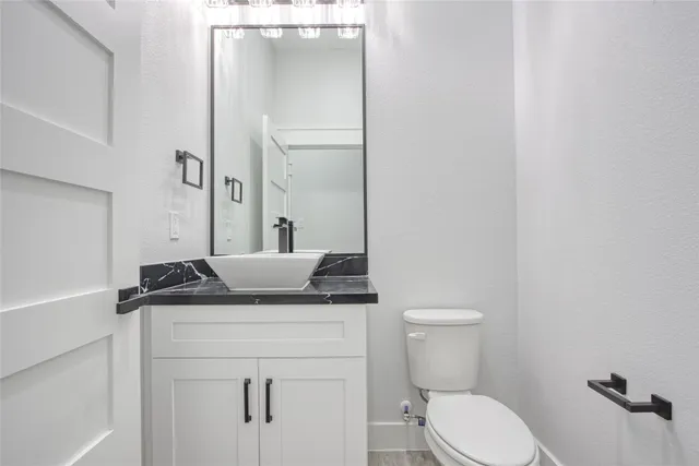 a kitchen with stainless steel appliances granite countertop a stove and a microwave