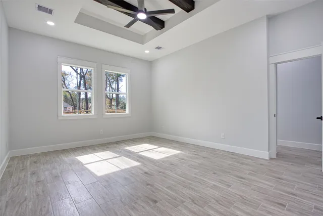 a kitchen with stainless steel appliances a sink a refrigerator and cabinets