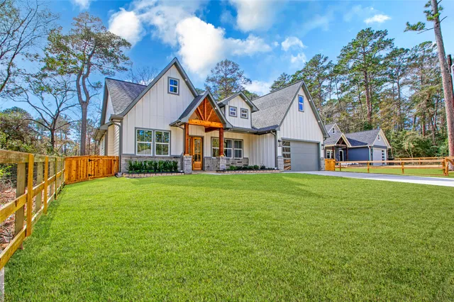 a front view of a house with a garden and porch