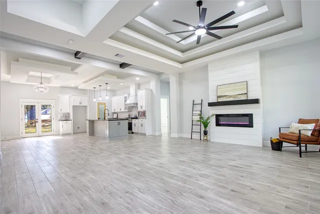 a view of a room with wooden floor
