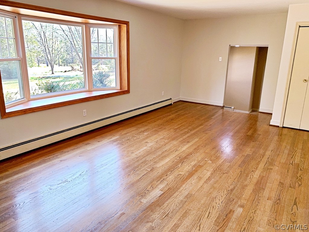 12447 Howards Mill Road Montpelier, VA 23192 - Photo 13 of 46 The Spacious Living Room is complimented by Hardwo