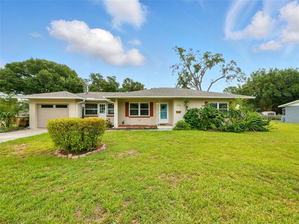 front view of a house with a yard