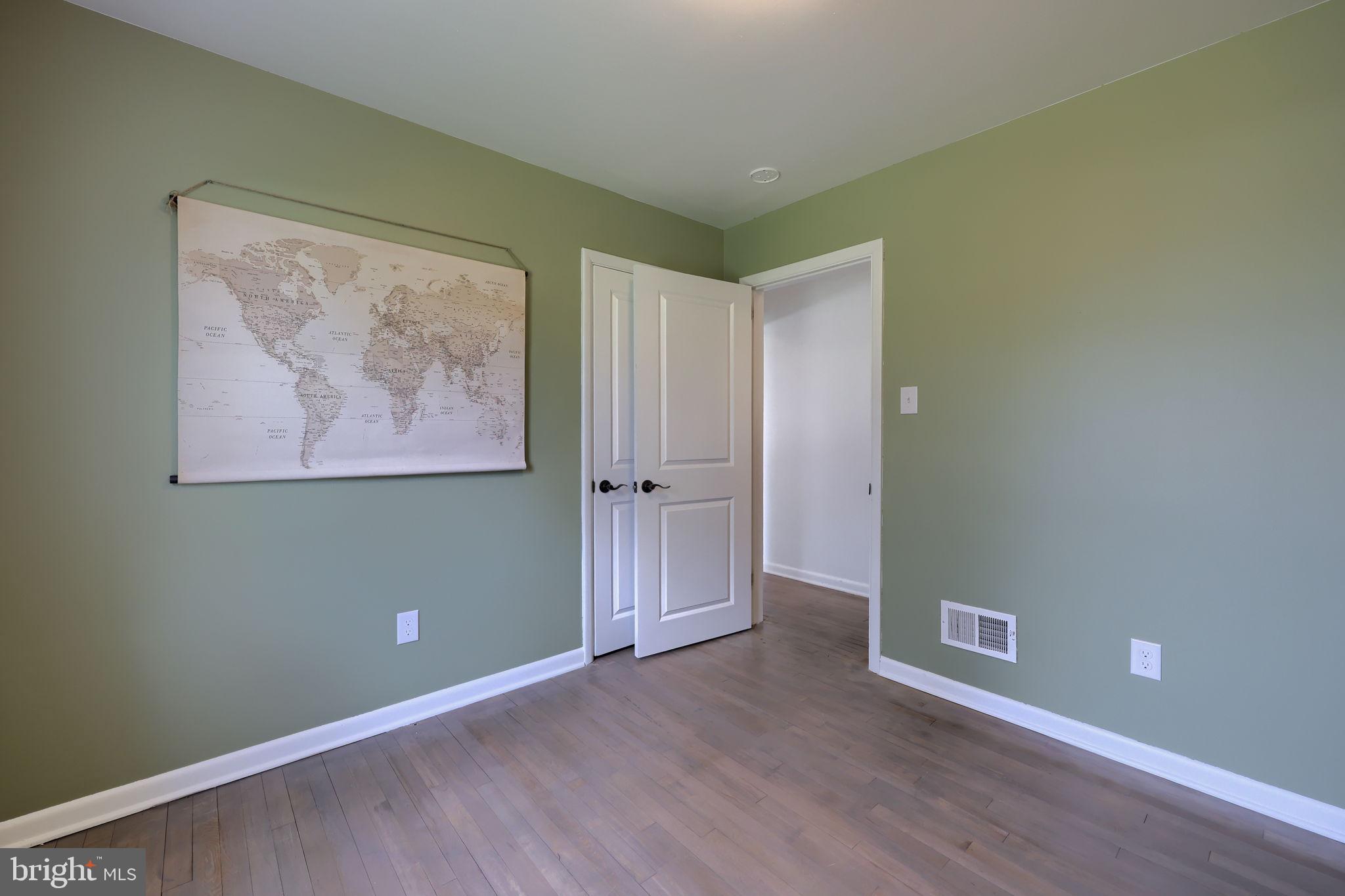 314 Dahlia Road Lancaster, PA 17602 - Photo 24 of 28 an empty room with wooden floor and windows