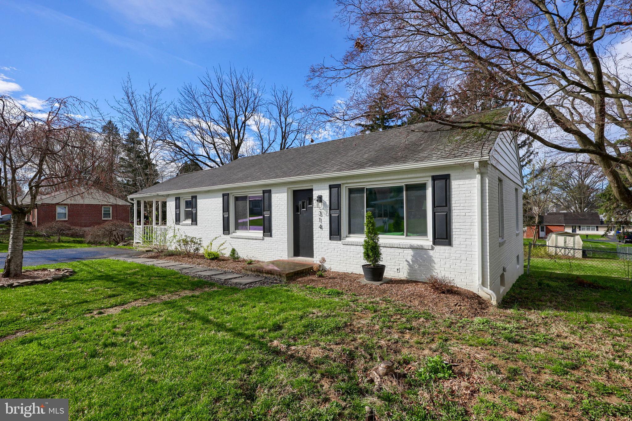 314 Dahlia Road Lancaster, PA 17602 - Photo 3 of 28 a front view of a house with a garden