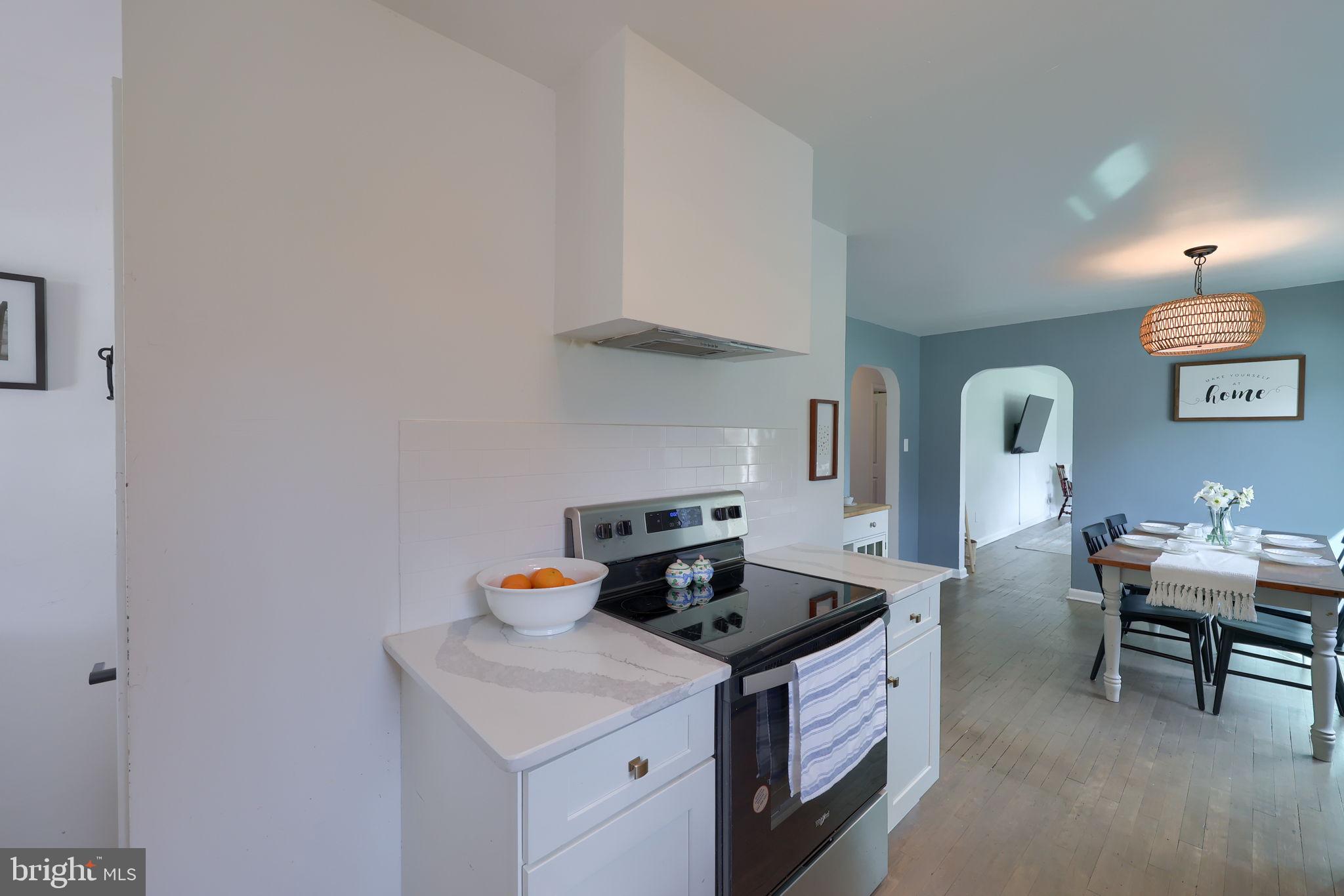 314 Dahlia Road Lancaster, PA 17602 - Photo 6 of 28 a kitchen with stainless steel appliances granite countertop a stove a sink and a refrigerator