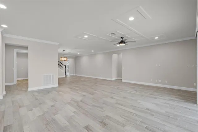 a kitchen with granite countertop wood cabinets and a sink