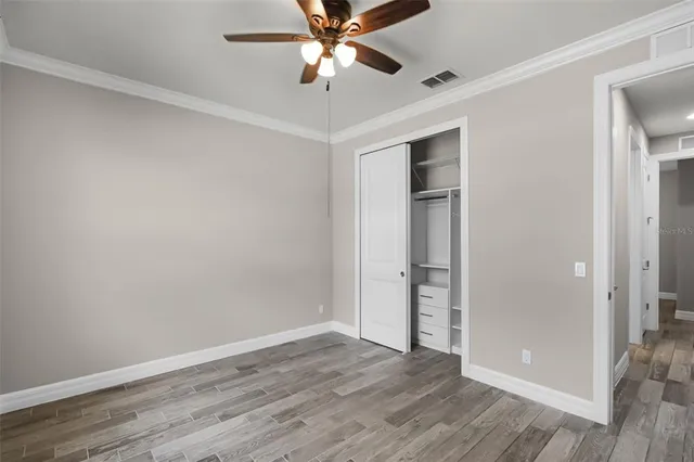 an empty room with wooden floor