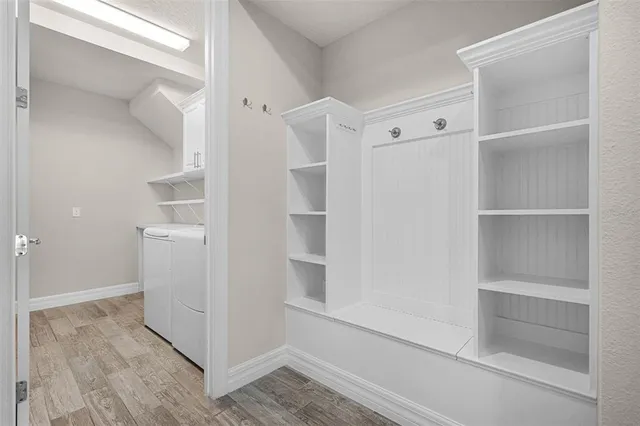 an empty room with windows and entrance