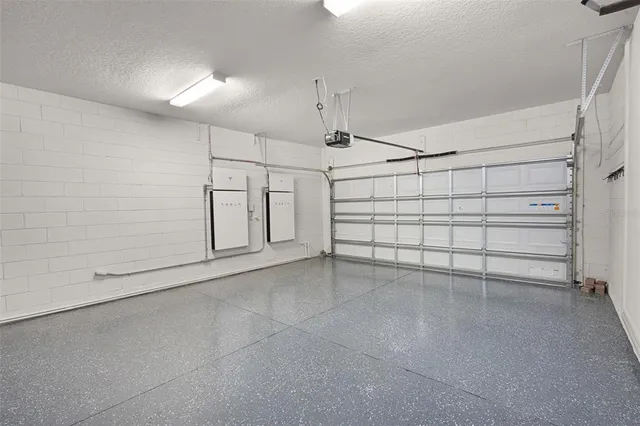 a bathroom with a granite countertop double vanity sink and a mirror