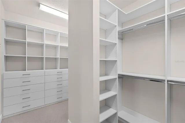 an empty room with a empty space and windows