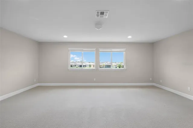 a bathroom with a granite countertop sink a toilet and bathtub