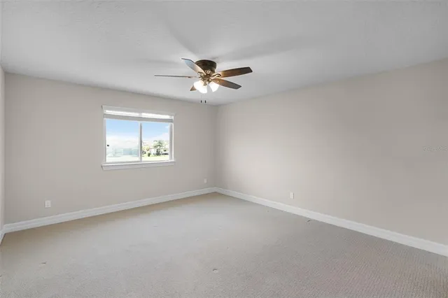 a view of an empty room with a balcony
