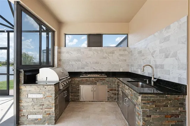 a front view of a house with a yard table and chairs