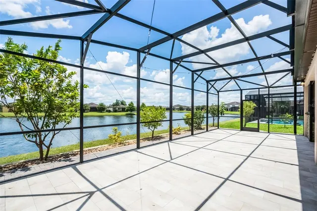 a view of a water with lawn chairs