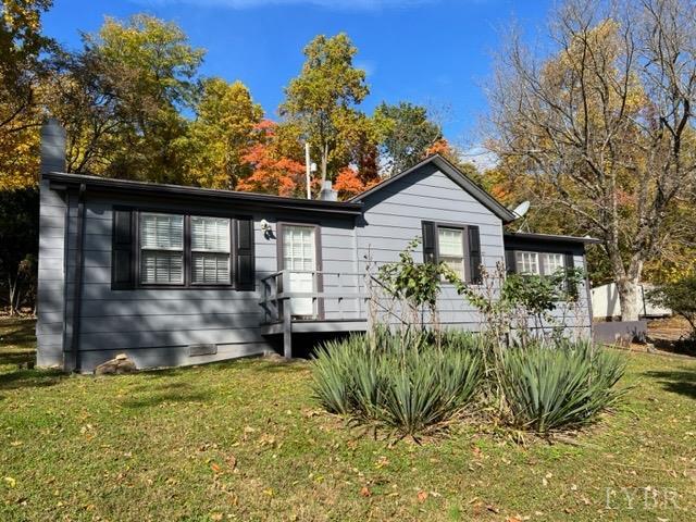 1999 High Peak Road Monroe, VA 24574 - Photo 1 of 15 a front view of a house with a garden