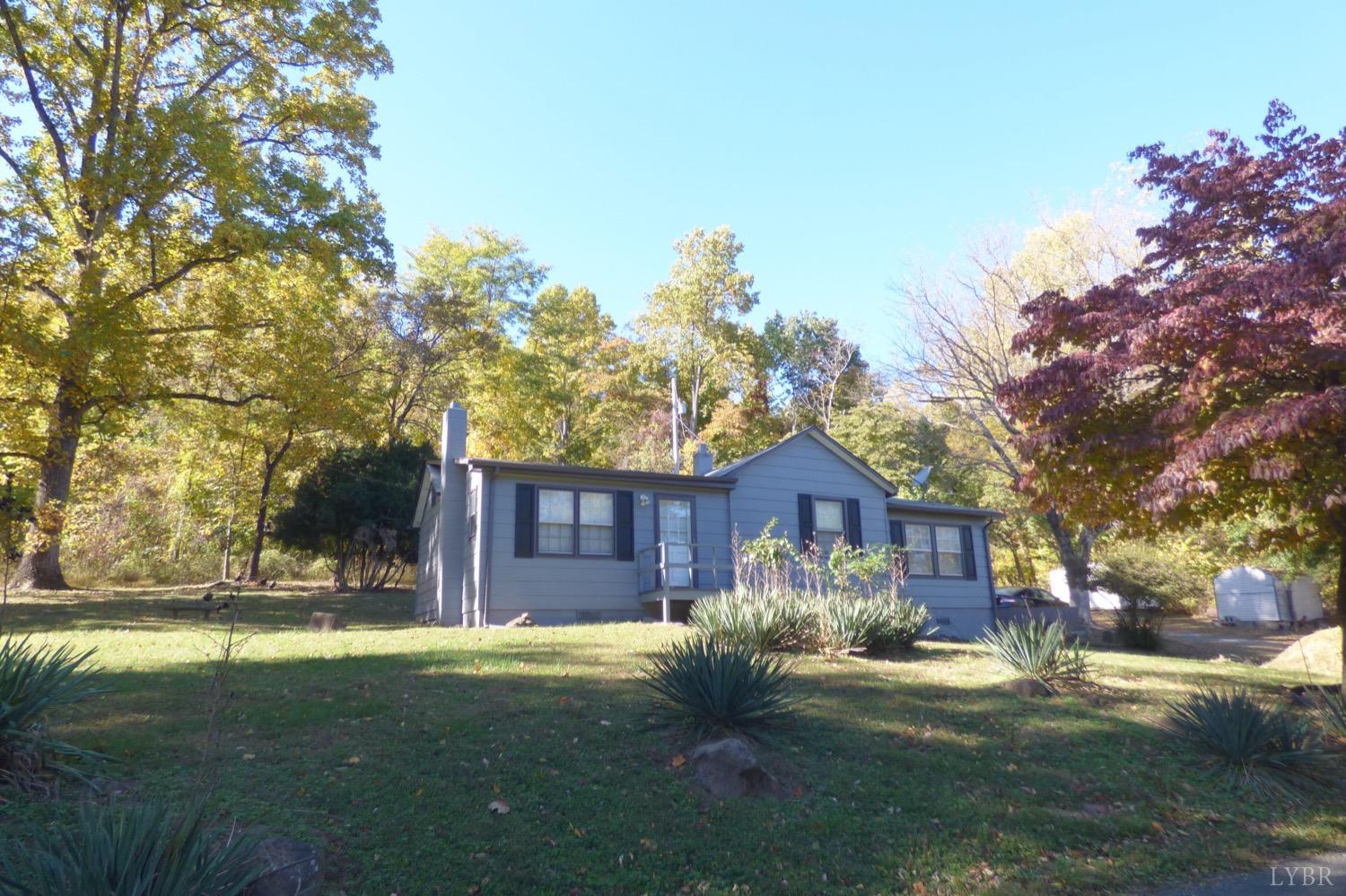 1999 High Peak Road Monroe, VA 24574 - Photo 14 of 15 a front view of a house with garden