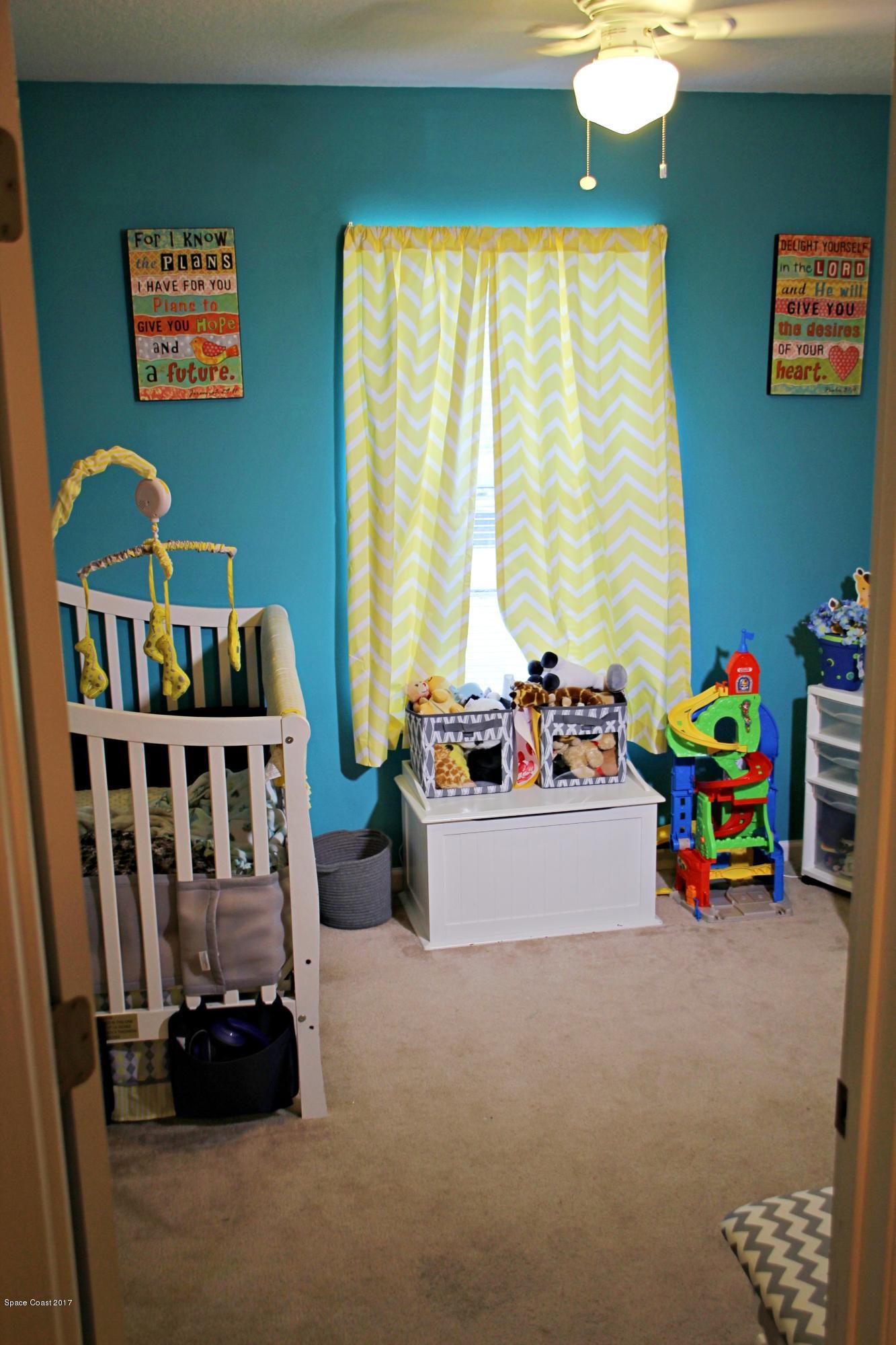 578 Wicker Road Southwest Palm Bay, FL 32908 - Photo 16 of 16 a children room with toys and toys