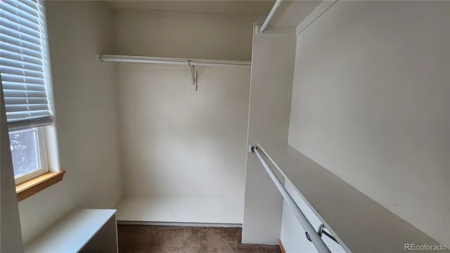 a view of an empty walk in closet