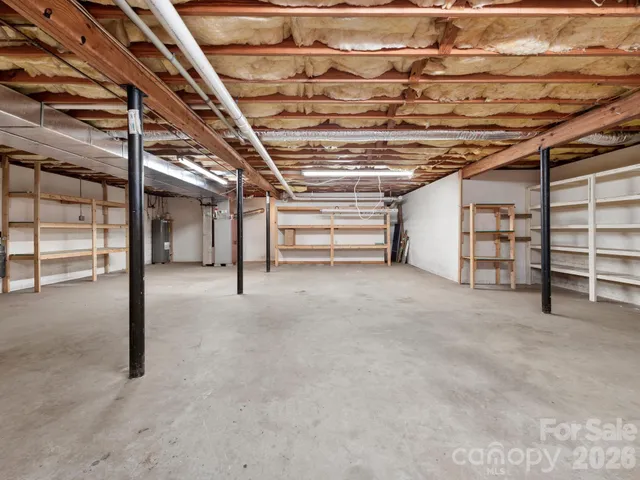 a view of an empty room with a staircase