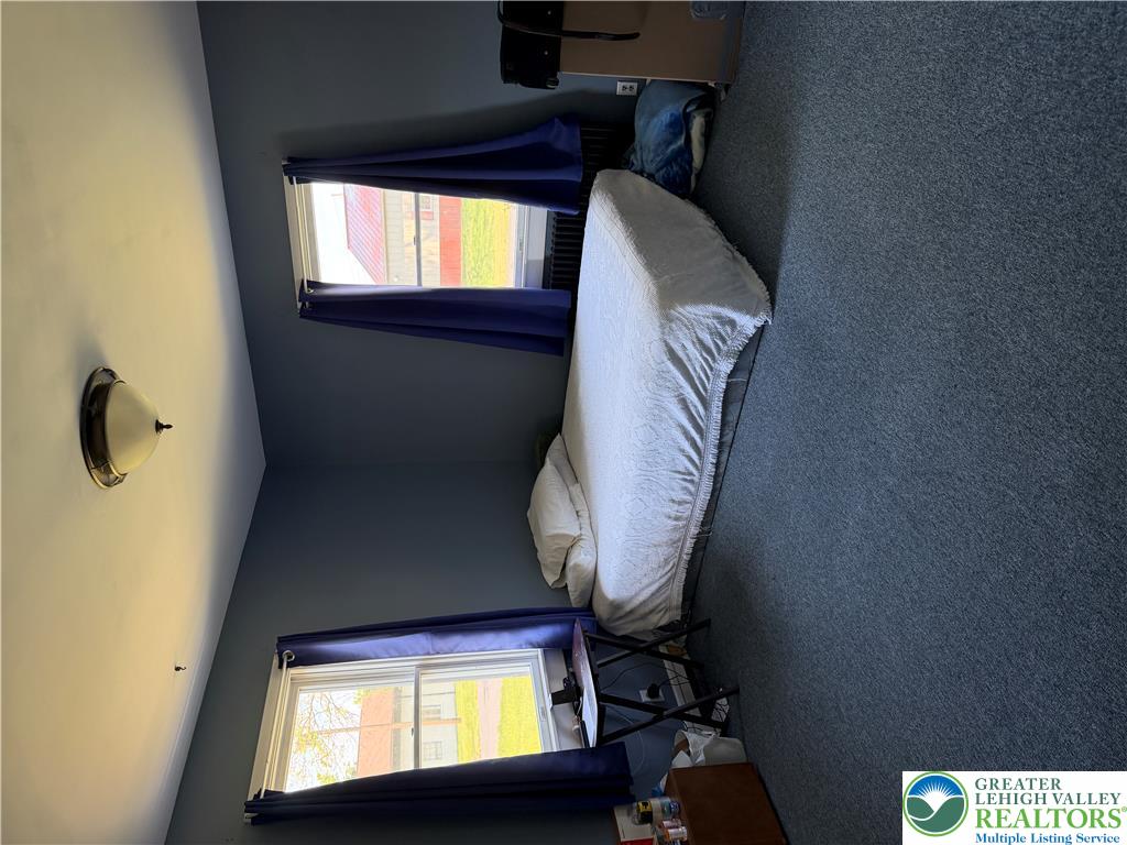 1340 Cowpath Road Hatfield, PA 19440 - Photo 12 of 16 a bedroom with a bed and a television