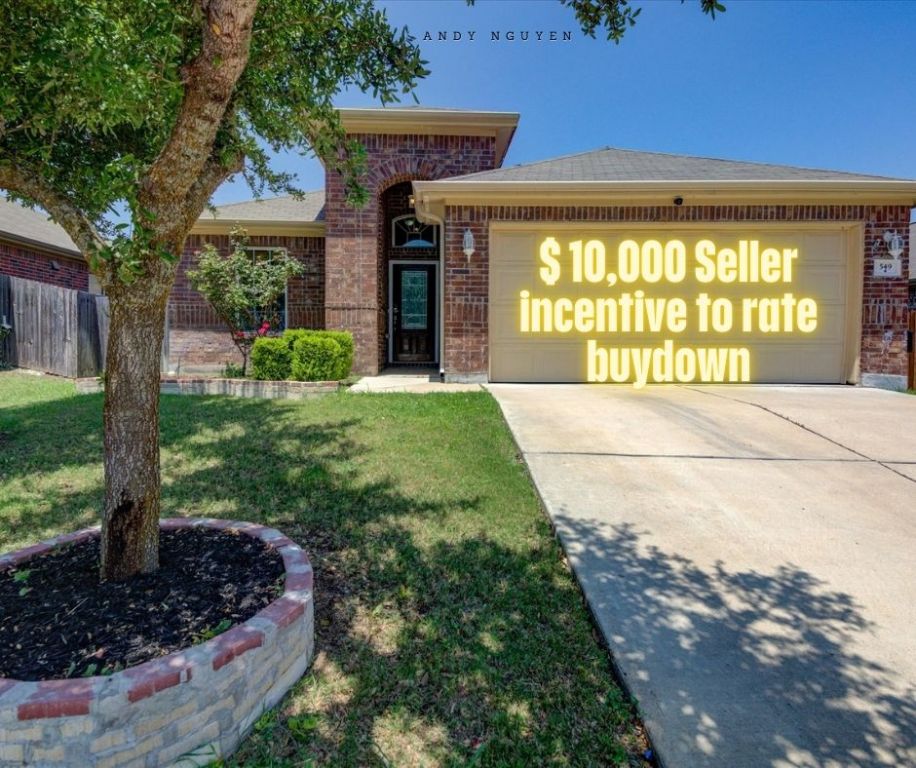 View of front of house with brick siding, an attached garage, concrete driveway, and a shingled roof