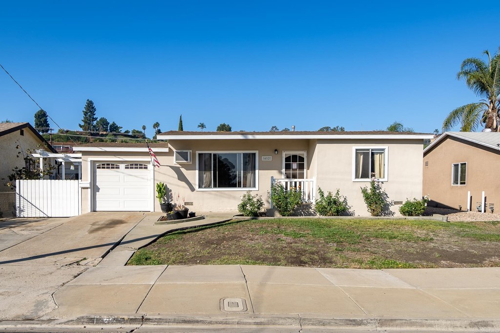 452 El Monte Road El Cajon, CA 92020 - Photo 1 of 1 a front view of a house with a yard