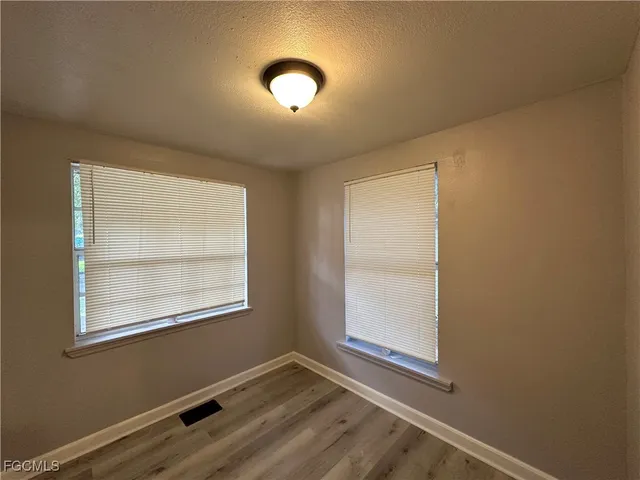 an empty room with windows