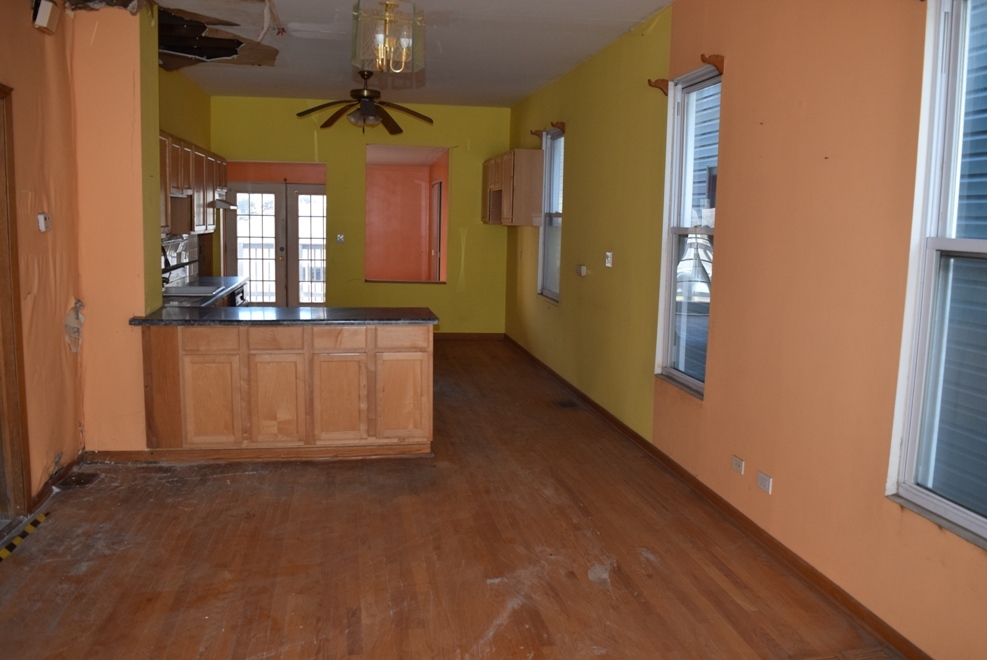 4519 North Western Avenue Chicago, IL 60625 - Photo 11 of 25 wooden floor in an empty room with a window