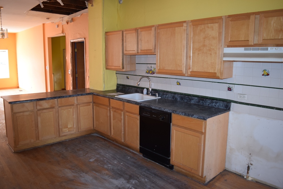 4519 North Western Avenue Chicago, IL 60625 - Photo 14 of 25 a kitchen with stainless steel appliances granite countertop a sink a stove cabinets and wooden floor