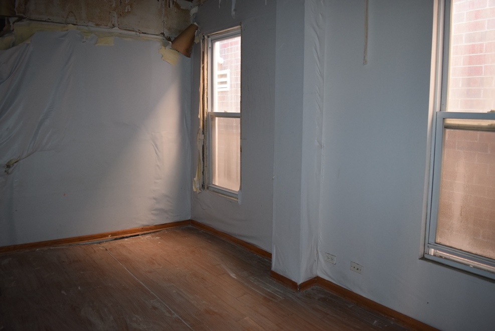 4519 North Western Avenue Chicago, IL 60625 - Photo 15 of 25 an empty room with wooden floor and windows