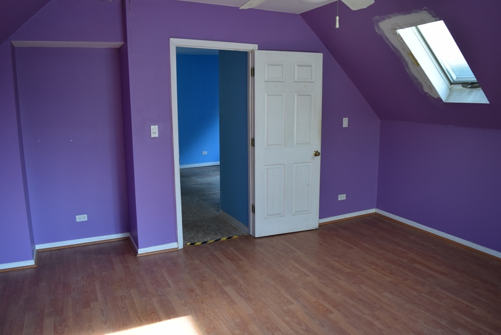 4519 North Western Avenue Chicago, IL 60625 - Photo 20 of 25 an empty room with wooden floor and windows