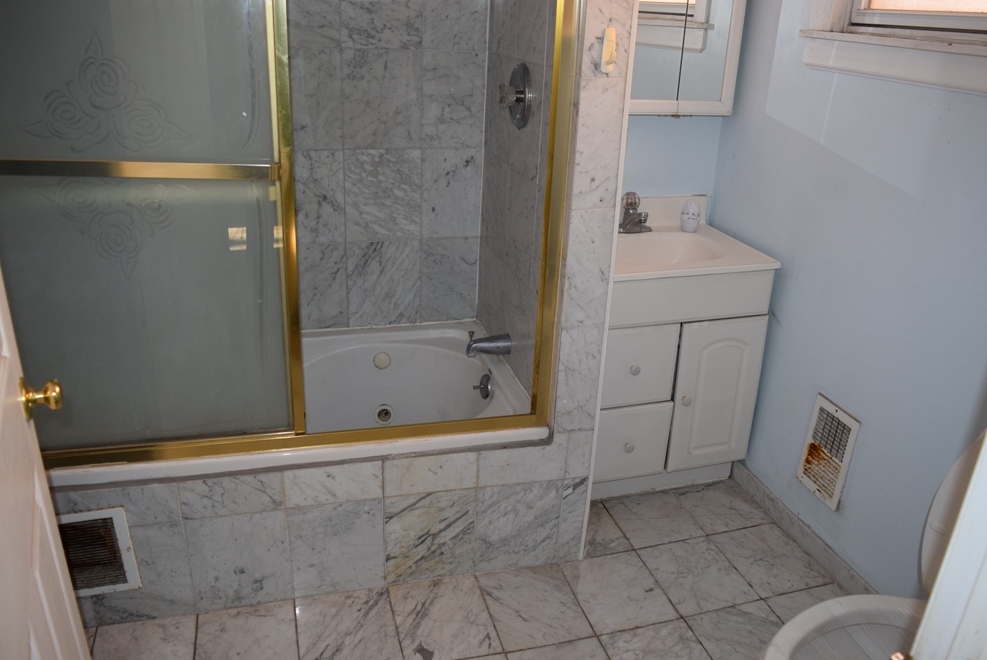 4519 North Western Avenue Chicago, IL 60625 - Photo 22 of 25 a bathroom with a sink and shower