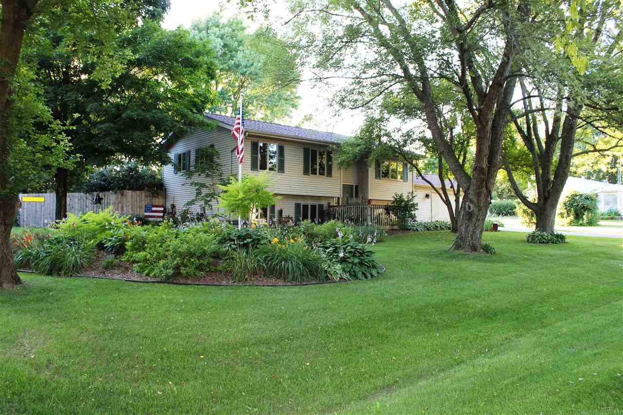 6056 North Knoll Road Monroe Center, IL 61052 - Photo 1 of 24 a front view of a house with a yard