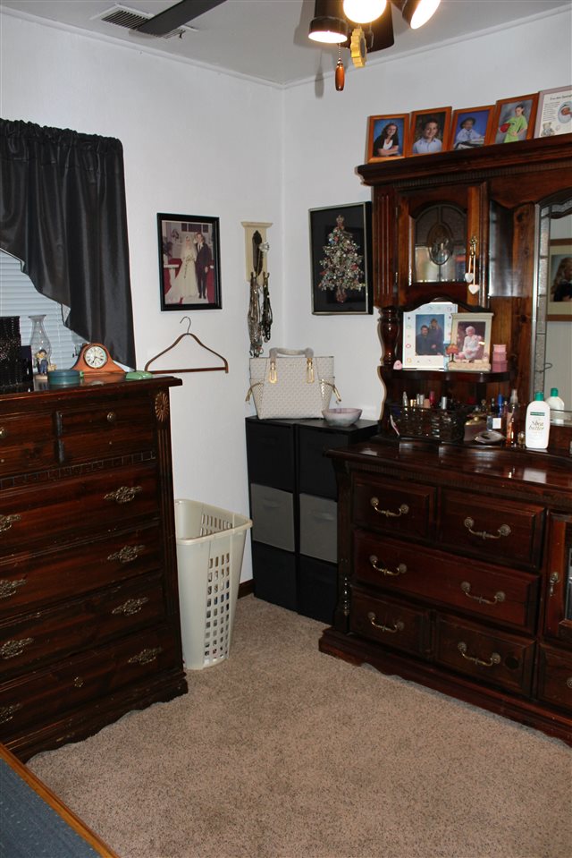 6056 North Knoll Road Monroe Center, IL 61052 - Photo 14 of 24 a room with a dresser and a mirror