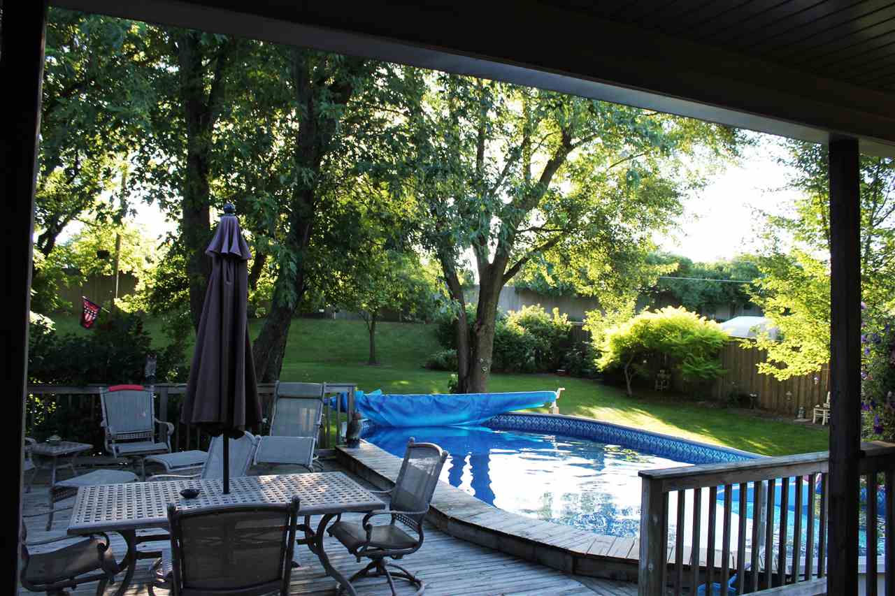 6056 North Knoll Road Monroe Center, IL 61052 - Photo 22 of 24 a view of a patio with chairs next to a yard