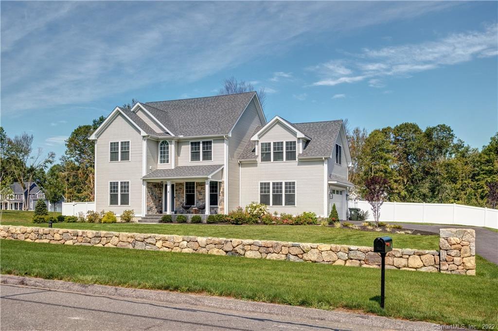 4 Turkey Roost Road Newtown, CT 06482 - Photo 1 of 1 a front view of a house with a yard