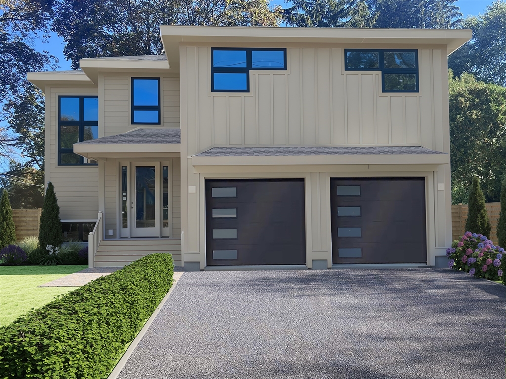 a view of a house with a yard and a garage